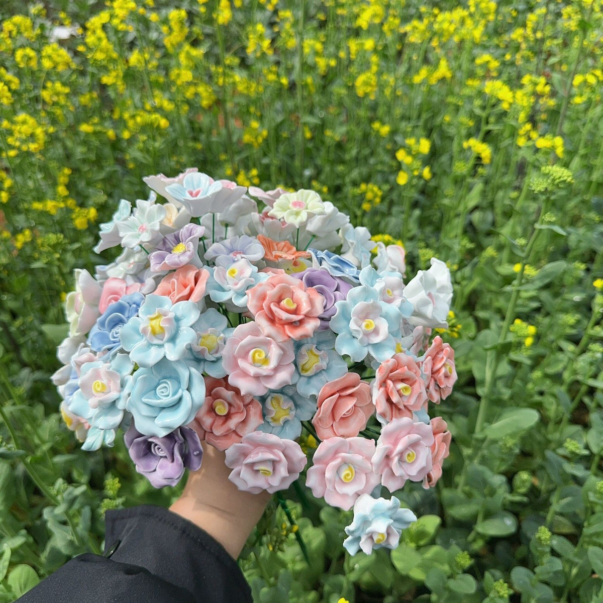 Artificial flowers in small vases for home decoration