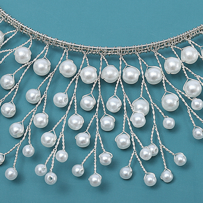 Exaggerated pearl standing crown