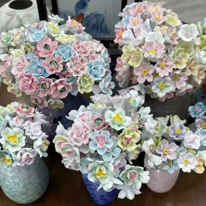 Artificial flowers in small vases for home decoration
