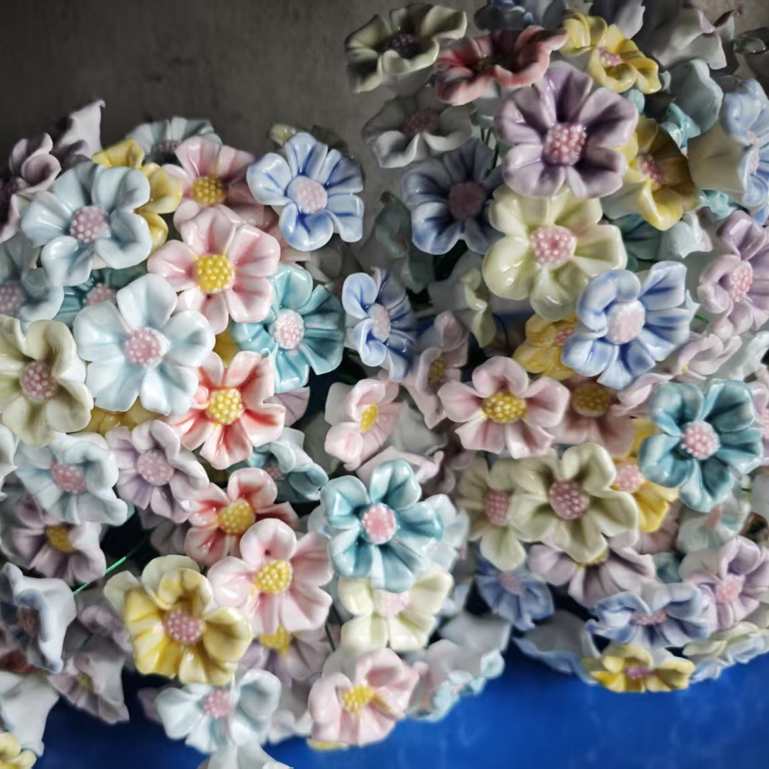 Artificial flowers in small vases for home decoration