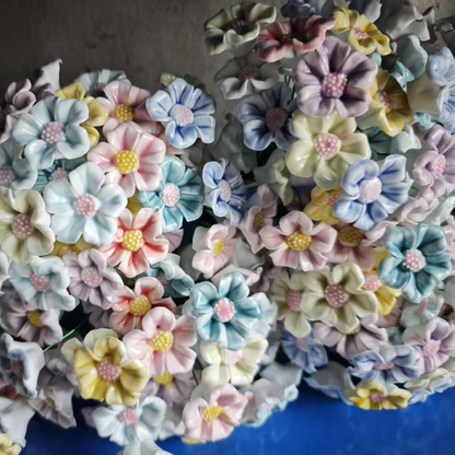 Artificial flowers in small vases for home decoration