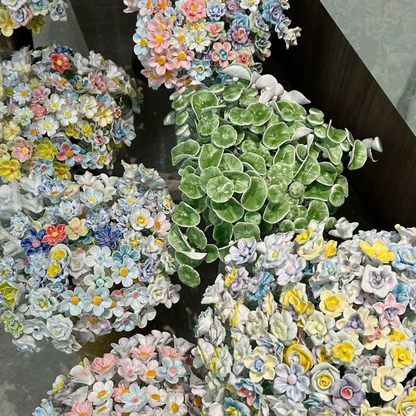 Artificial flowers in small vases for home decoration
